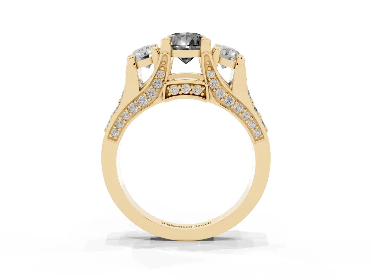 Fancy Black Pear Cut Diamond Three-Stone Ring with Channel Set Band and Four-Prong Setting Yellow gold
