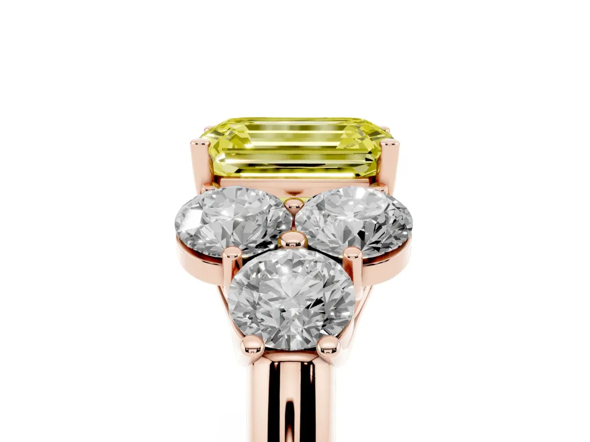 Fancy Yellow Emerald Cut Cut Diamond Cluster Ring with Round Accent Stones and Prong Setting on a Classic Band Rose gold