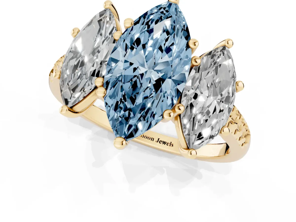 Fancy Blue Three-Stone Marquise Cut Diamond Ring with Round Pavé Band and Prong Setting Yellow gold