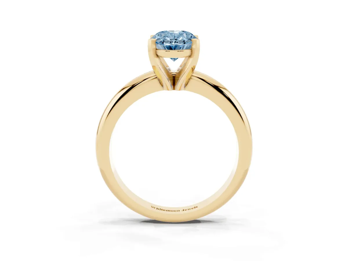 Fancy Blue Oval Cut Diamond Solitaire Engagement Ring with Round Band and Four-Prong Setting Yellow gold