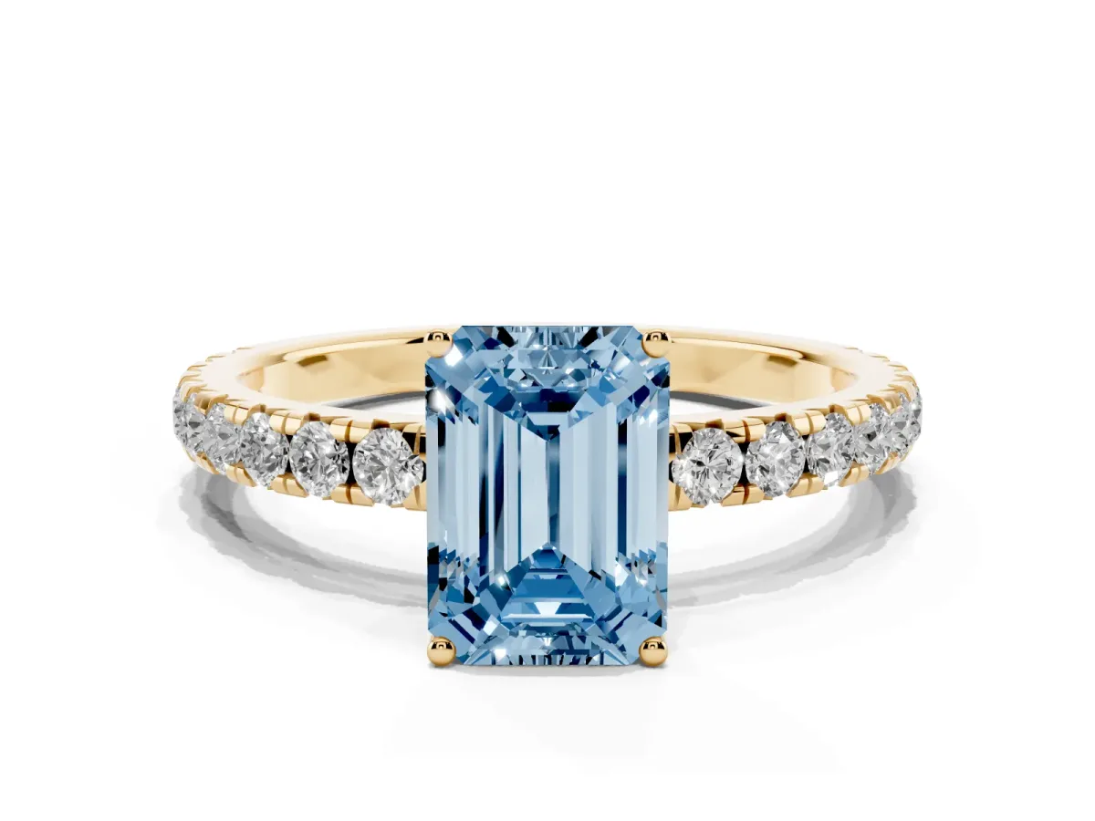 Fancy Blue Emerald Cut Diamond Pavé Solitaire Engagement Ring with Four-Prong Setting Yellow gold
