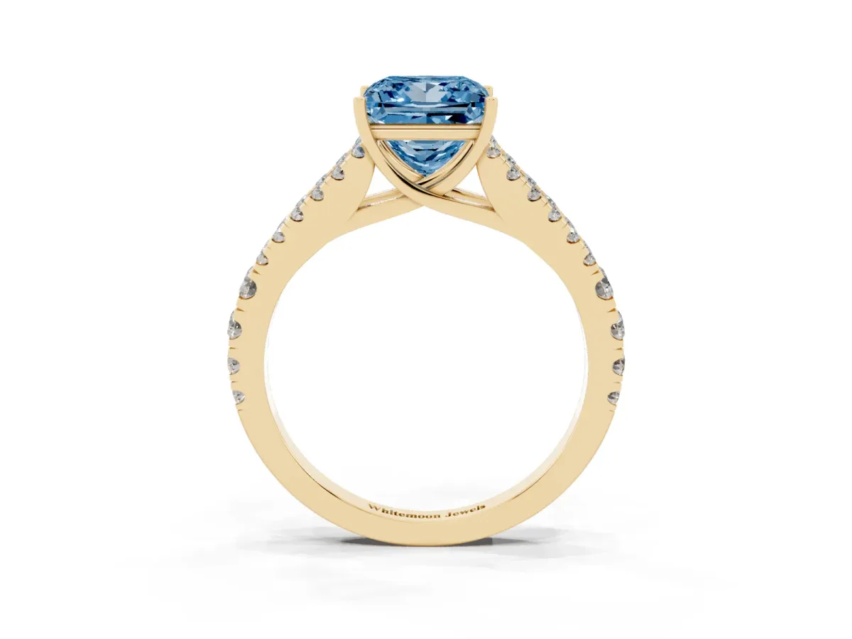 Fancy Blue Princess Cut Diamond Split Shank Pavé Engagement Ring with Four-Prong Setting Yellow gold