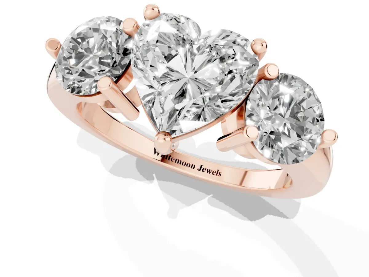 Three-Stone Heart Cut Brilliant Cut Solitaire Ring with Prong Setting on a Classic Band Rose gold