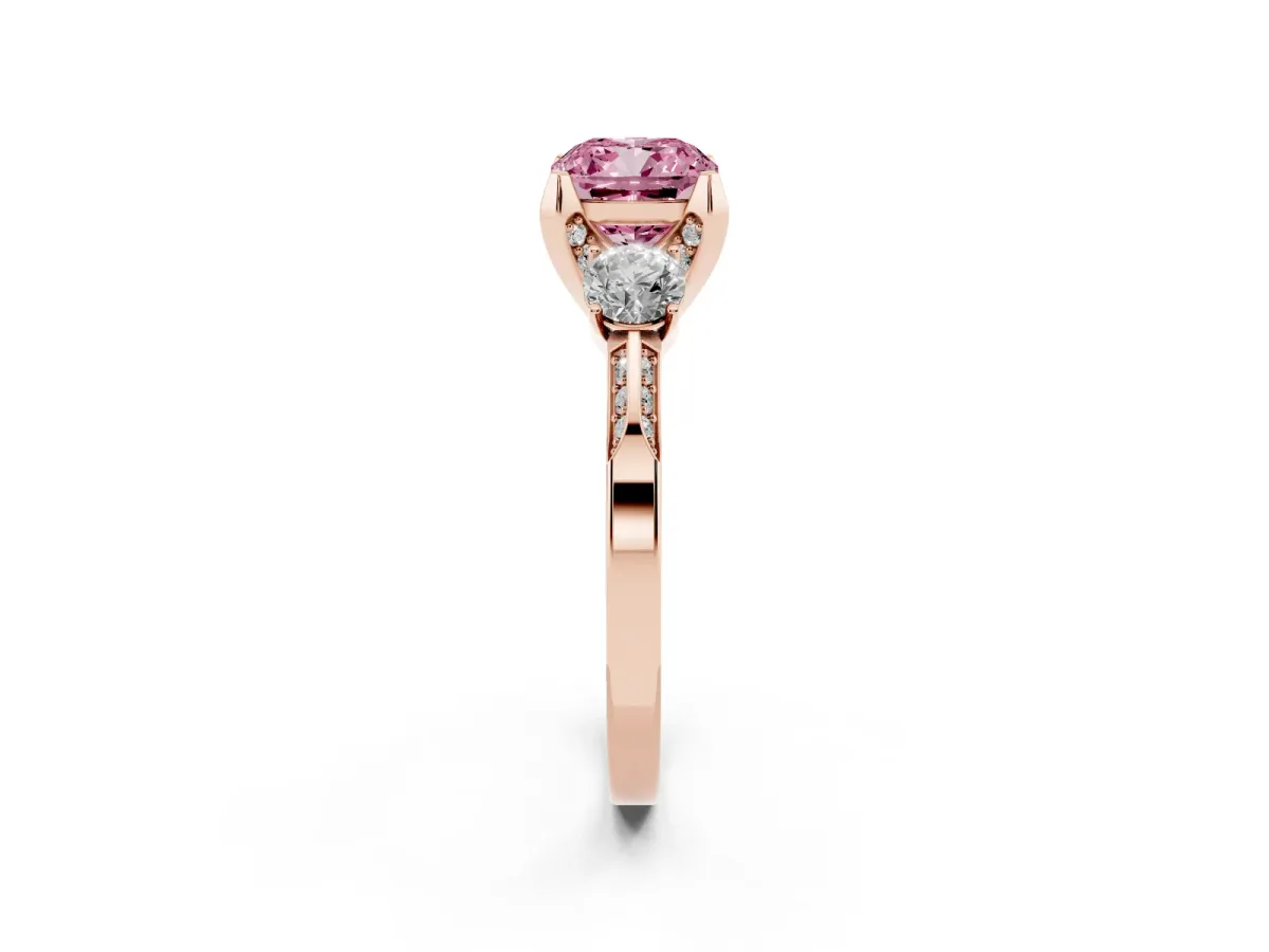 Fancy Pink Cushion Cut Brilliant Three-Stone Diamond Ring with Pavé Band and Four-Prong Setting Rose gold