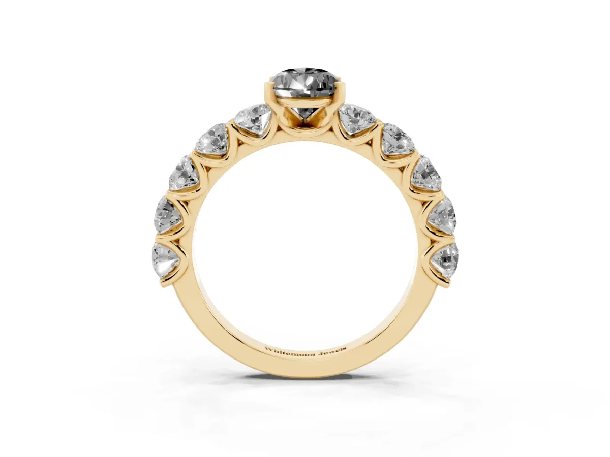 Fancy Black Pear Cut Diamond Prong Setting with Side Stones on a Pave Band Yellow gold