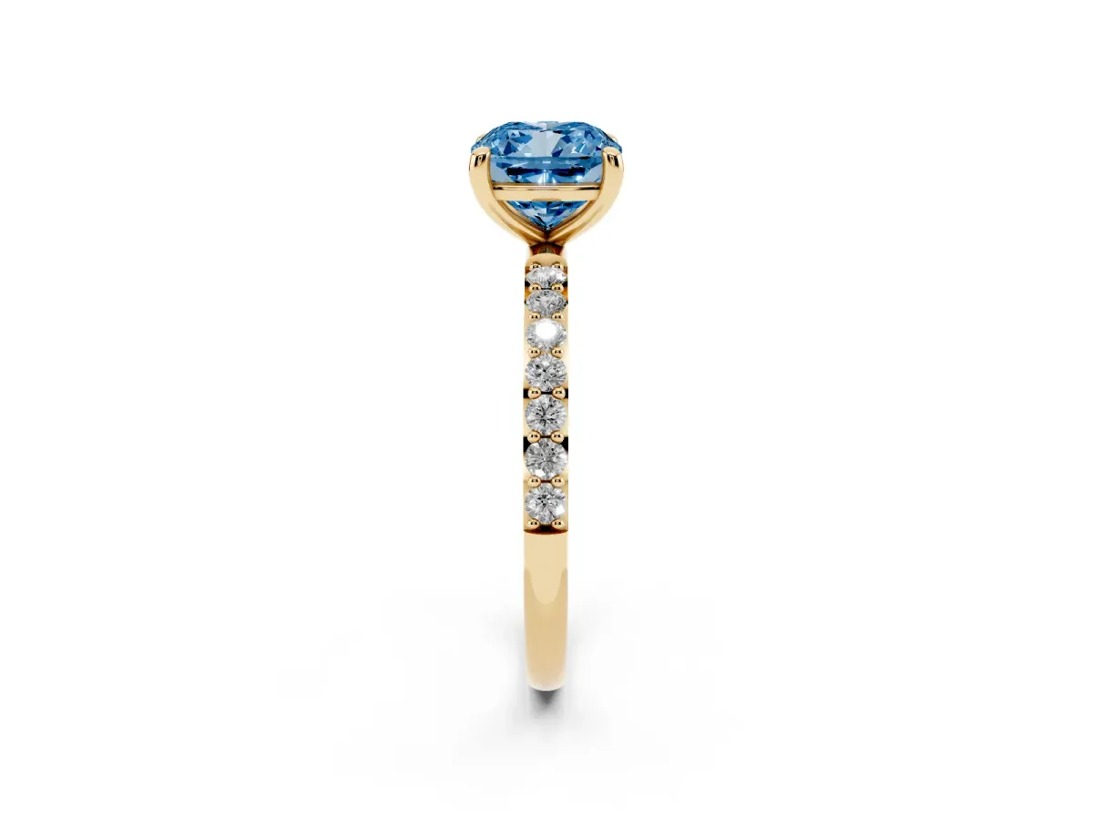 Fancy Blue Cushion Cut Diamond Solitaire Ring with Round Pavé Band and Prong Setting Yellow gold