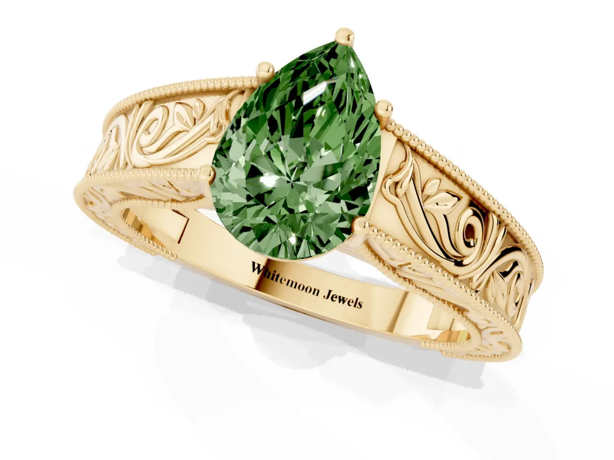 Fancy Green Pear Cut Diamond Solitaire Ring with Engraved Band and Four-Prong Setting Yellow gold