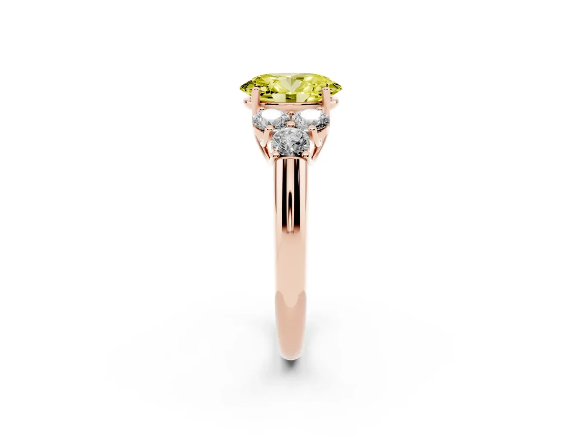 Fancy Yellow Oval Cut Cut Diamond Cluster Ring with Round Accent Stones and Prong Setting on a Classic Band Rose gold