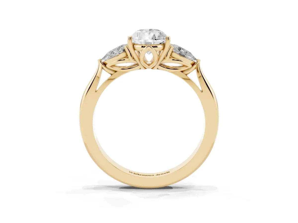 Three-Stone Pear Cut Diamond Ring with Pear Side Stones in Four-Prong Setting Yellow gold