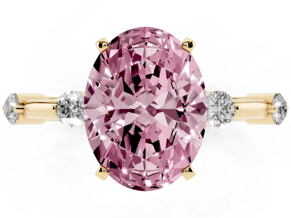 Fancy Pink Oval Cut Solitaire Diamond Ring with Bezel Set Side Stones and Prong Setting Yellow gold