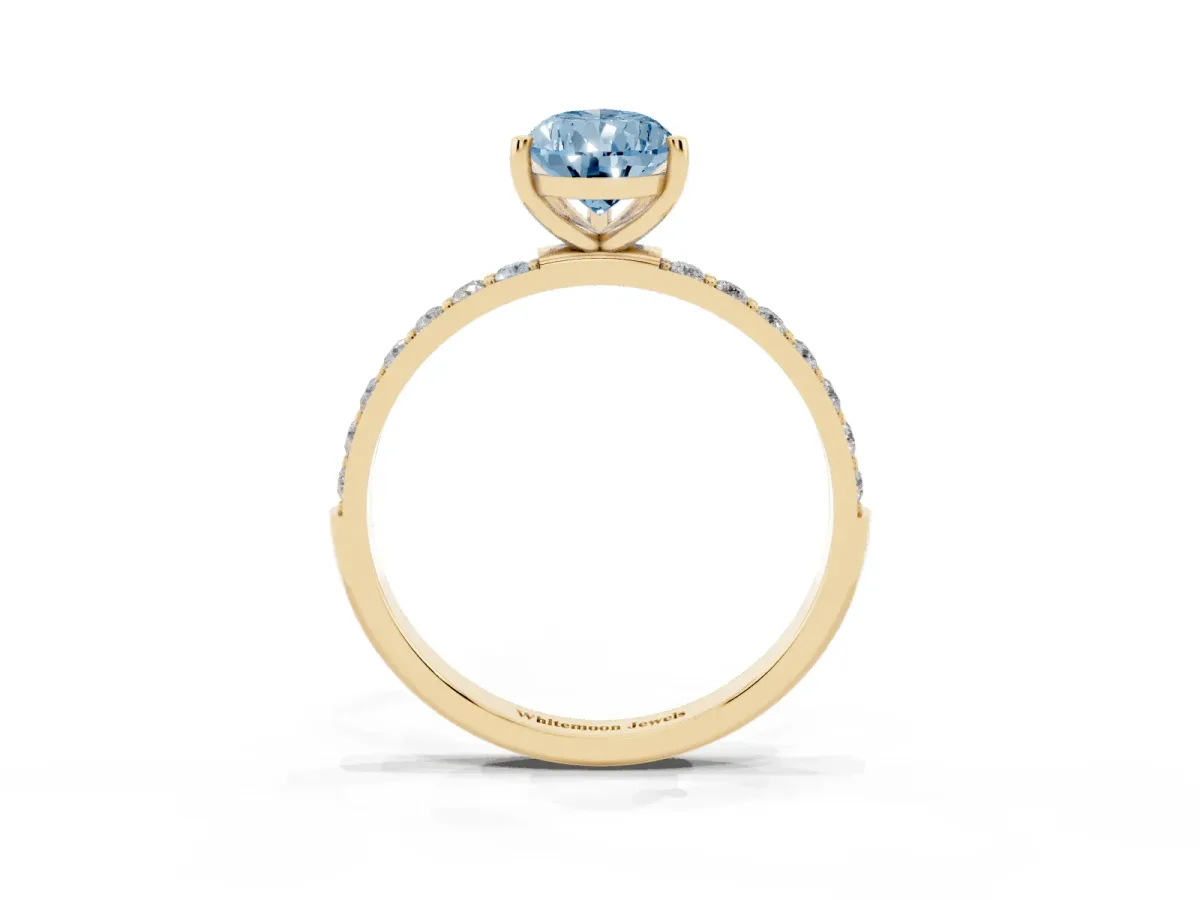 Fancy Blue Pear Cut Diamond Solitaire Ring with Round Pavé Shoulders and Prong Setting Yellow gold