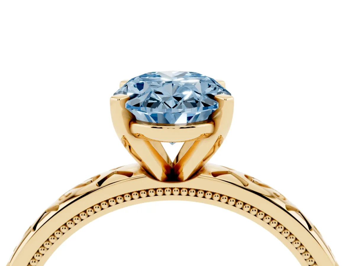 Fancy Blue Oval Cut Solitaire Engagement Ring with Scrollwork Band and Four-Prong Setting Yellow gold