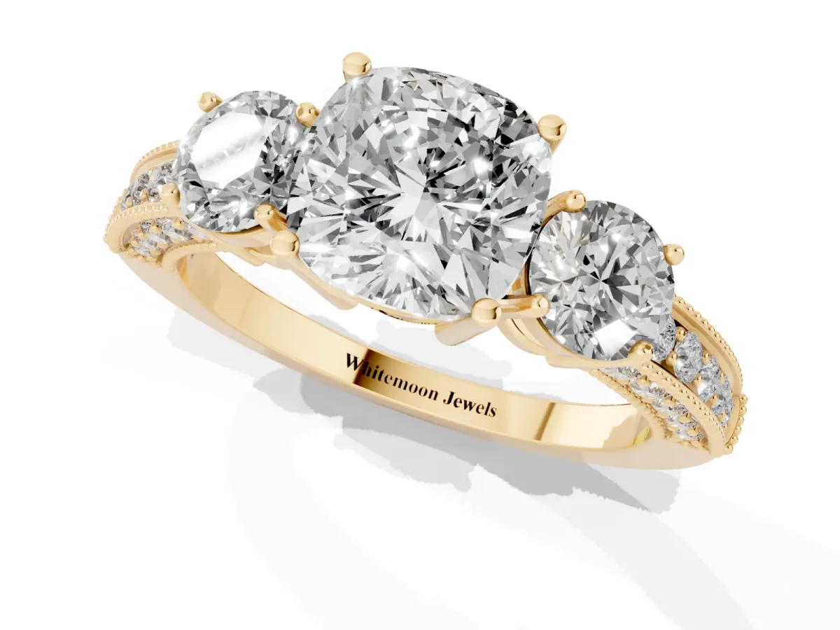 Cushion Cut Three-Stone Diamond Ring with Pavé Band and Four-Prong Setting Yellow gold