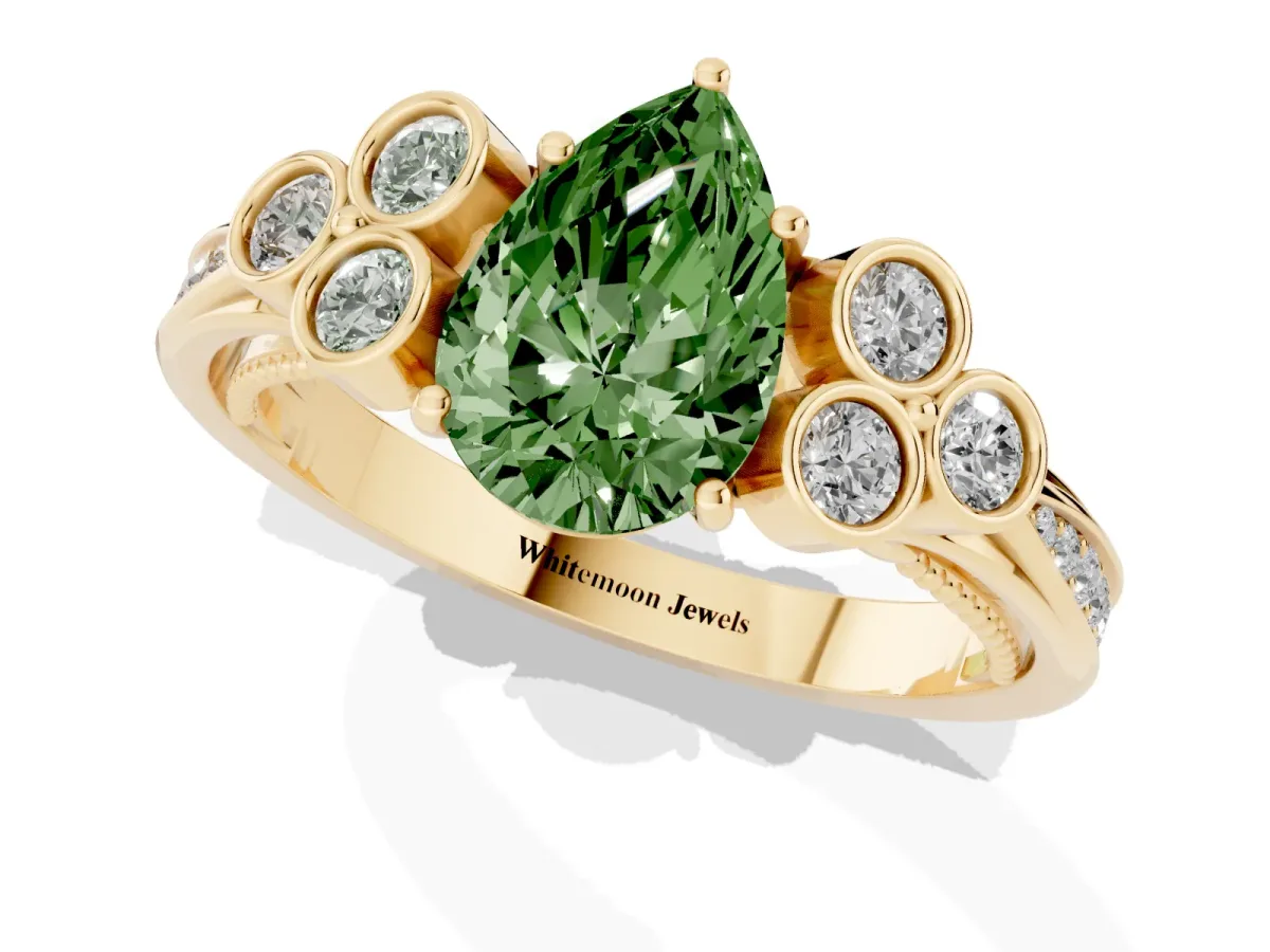 Fancy Green Pear Cut Cut Diamond Engagement Ring with Bezel Set Round Side Stones and Prong Setting Yellow gold