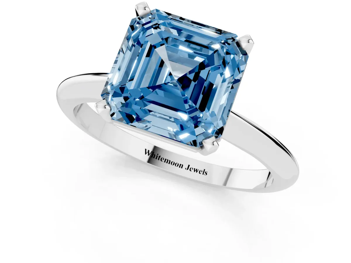 Fancy Blue Asscher Cut Cut Solitaire Ring with Four-Prong Setting on a Classic Band Platinum