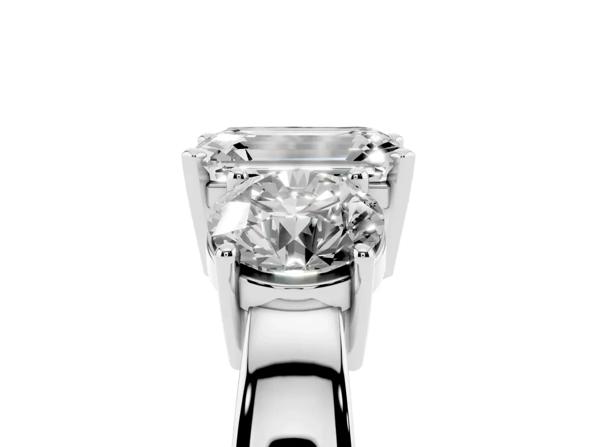 Three-Stone Emerald Cut Diamond Ring with Round Side Stones, Classic Band, and Four-Prong Setting Silver