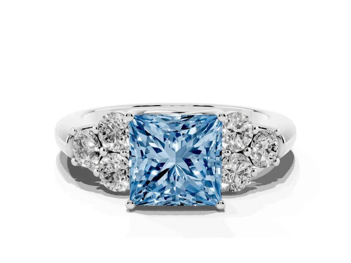 Fancy Blue Princess Cut Cut Diamond Cluster Ring with Round Accent Stones and Prong Setting on a Classic Band Silver