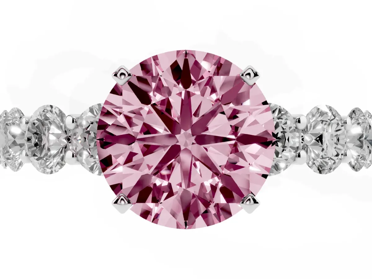 Fancy Pink Round Cut Diamond Prong Setting with Side Stones on a Pave Band Silver