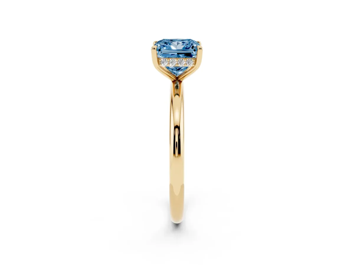 Fancy Blue Princess Cut Diamond Solitaire Ring with Thin Band and Four-Prong Setting Yellow gold