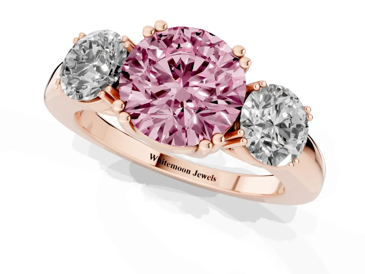 Fancy Pink Three-Stone Round Cut Cut Diamond Ring with Channel Set Band and Four-Prong Setting Rose gold