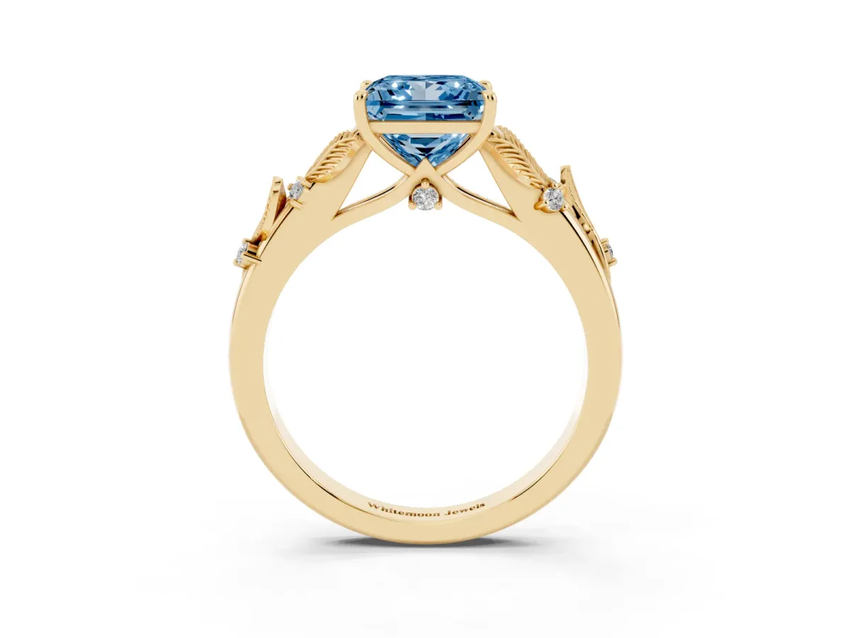 Fancy Blue Princess Cut Diamond Solitaire Ring with Leaf Motif Band and Four-Prong Setting Yellow gold