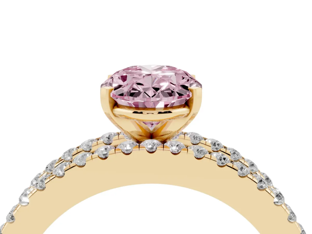 Fancy Pink Oval Cut Diamond Solitaire Ring with Pavé and Channel Set Band Yellow gold