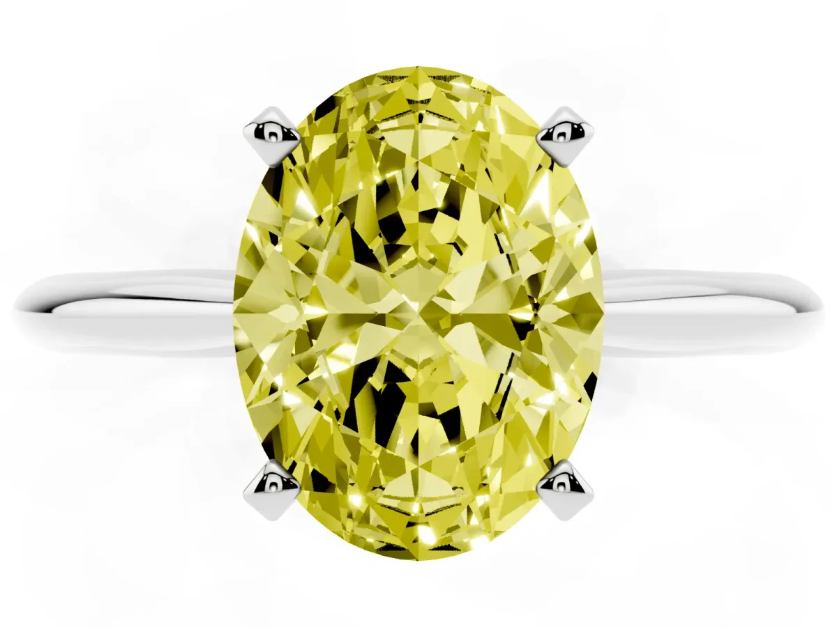 Fancy Yellow Oval Cut Cut Solitaire Ring with Four-Prong Setting on a Classic Band Platinum