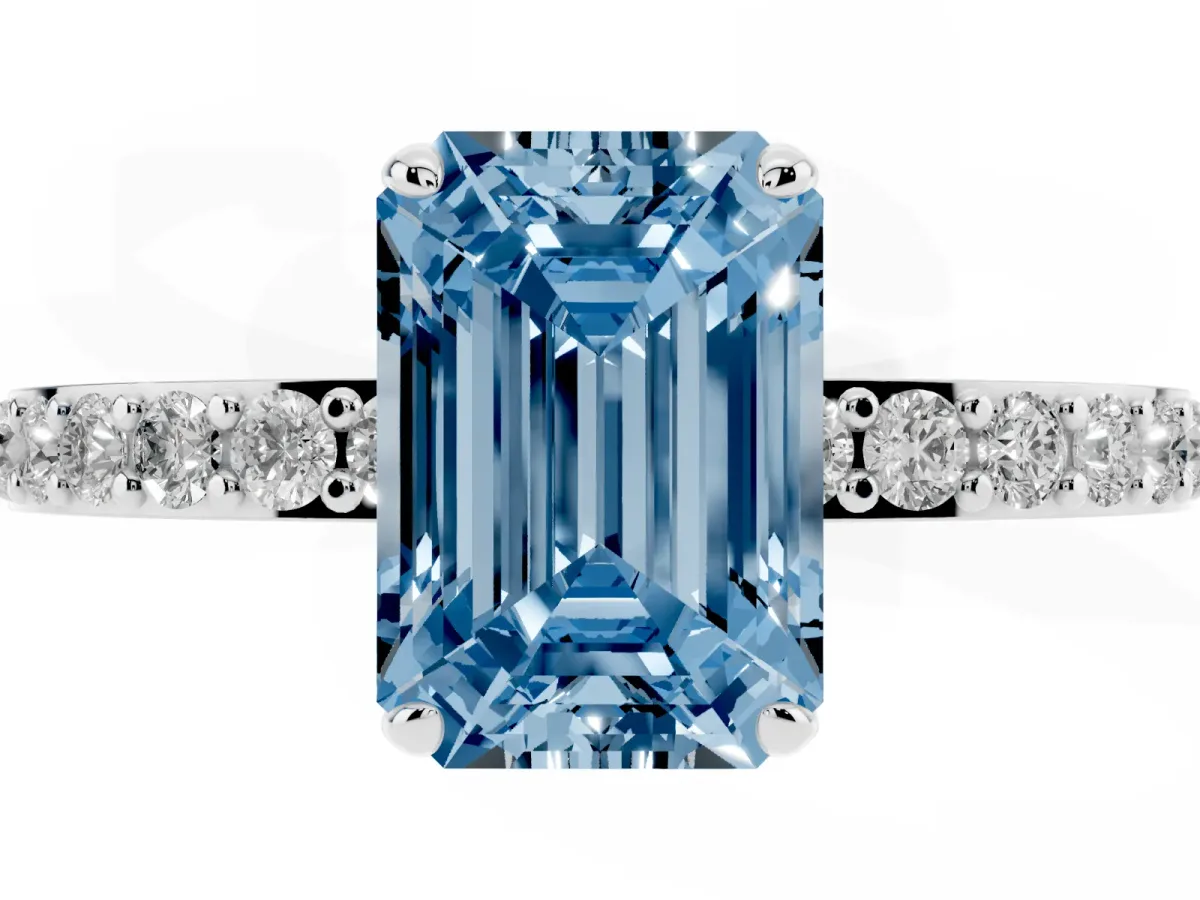 Fancy Blue Emerald Cut Diamond Solitaire Engagement Ring with Pavé Band and Four-Prong Setting Silver