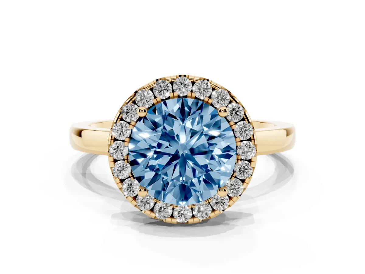 Fancy Blue Round Cut Halo Diamond Solitaire with Pavé Band and Four-Prong Setting Yellow gold