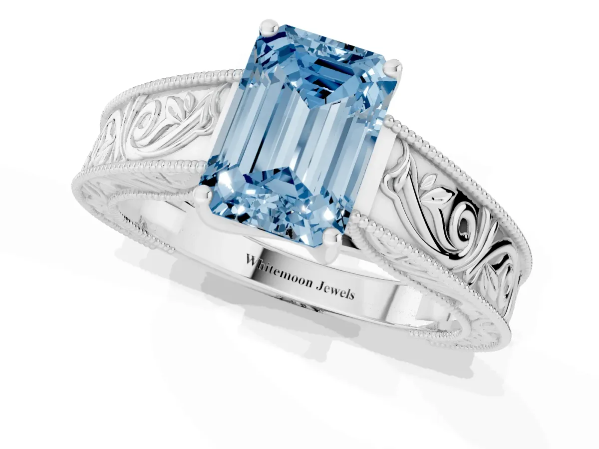 Fancy Blue Emerald Cut Diamond Solitaire Ring with Engraved Band and Four-Prong Setting Platinum