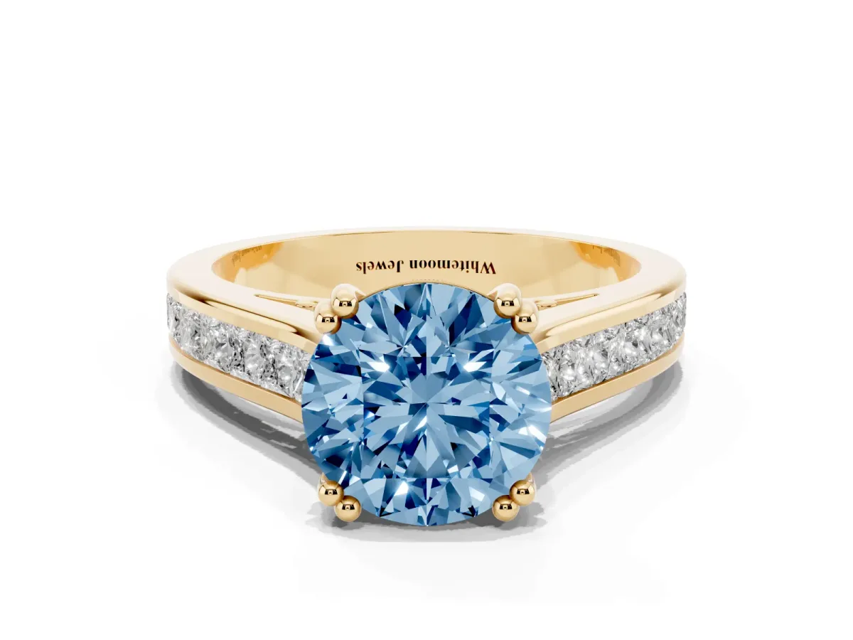 Fancy Blue Round Cut Cut Channel Set Solitaire Engagement Ring with Prong Setting Yellow gold