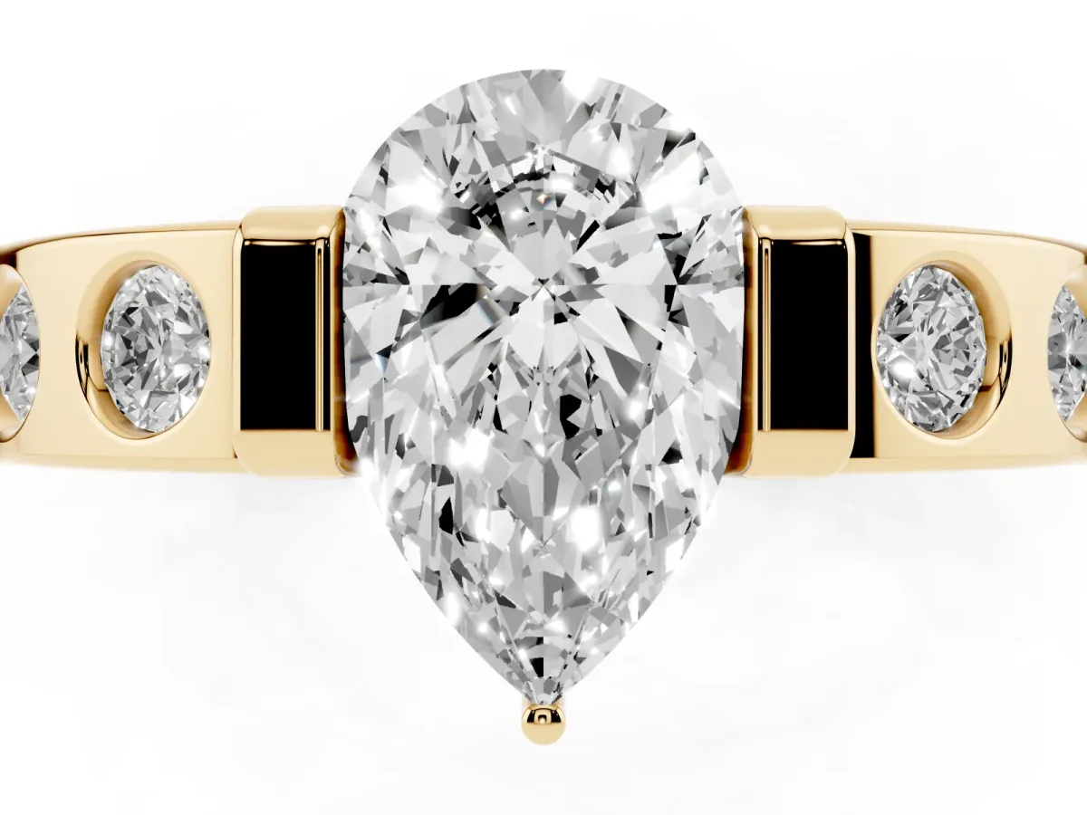 Pear Cut Brilliant Channel-Set Diamond Ring with Bezel Prong Setting Yellow gold
