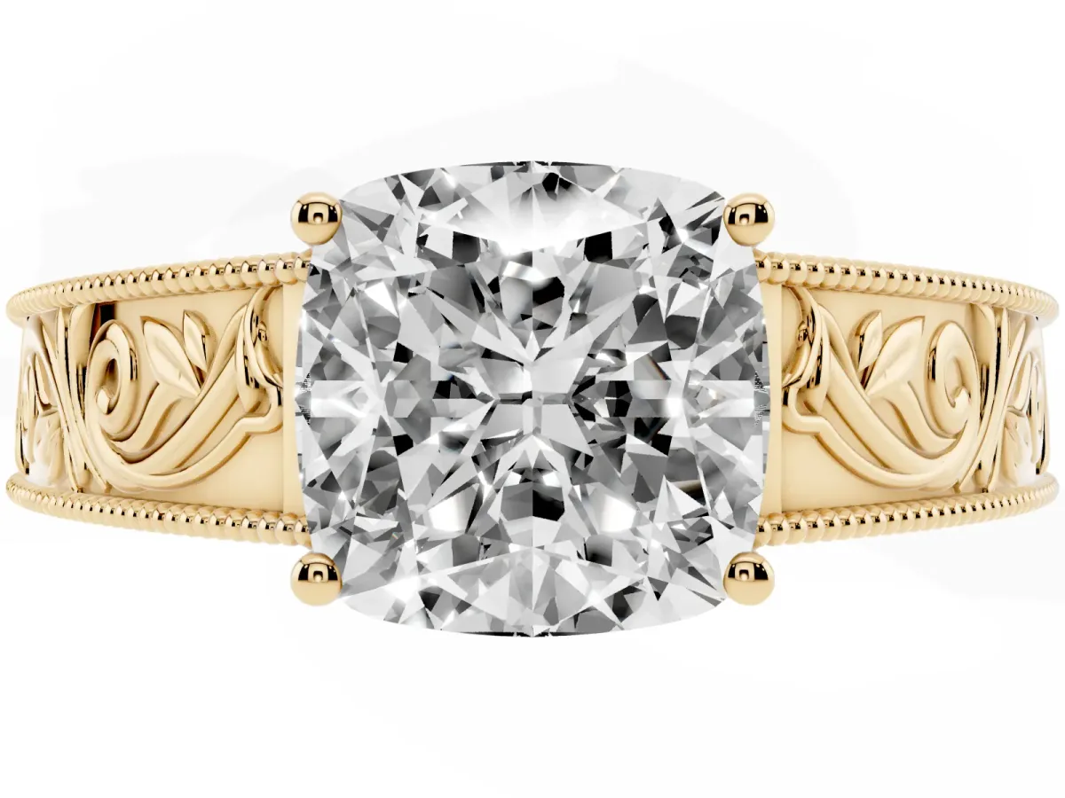 Cushion Cut Diamond Solitaire Ring with Engraved Band and Four-Prong Setting Yellow gold