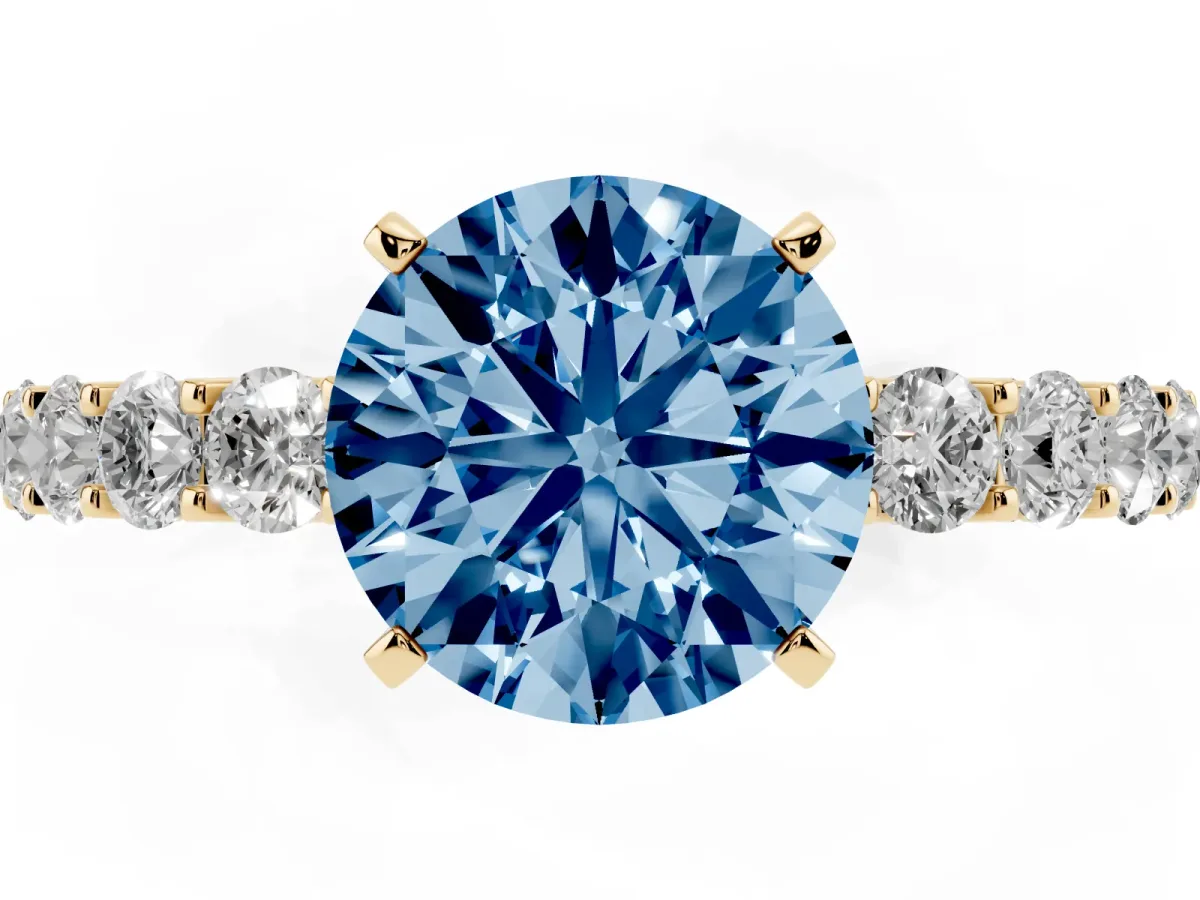 Fancy Blue Round Cut Diamond Solitaire Ring with Shared Prong Pavé Band and Four-Prong Setting Yellow gold