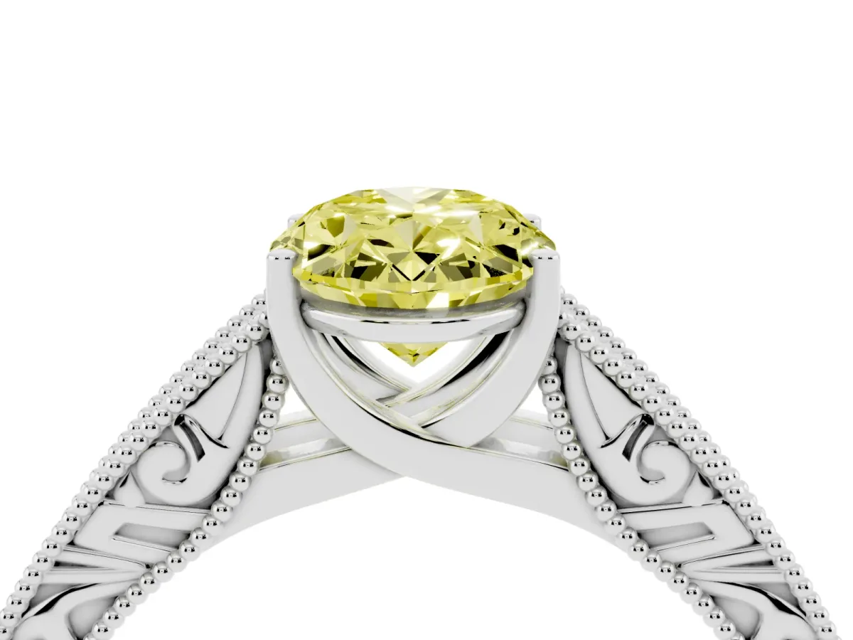 Fancy Yellow Oval Cut Diamond Solitaire Ring with Engraved Band and Four-Prong Setting Silver