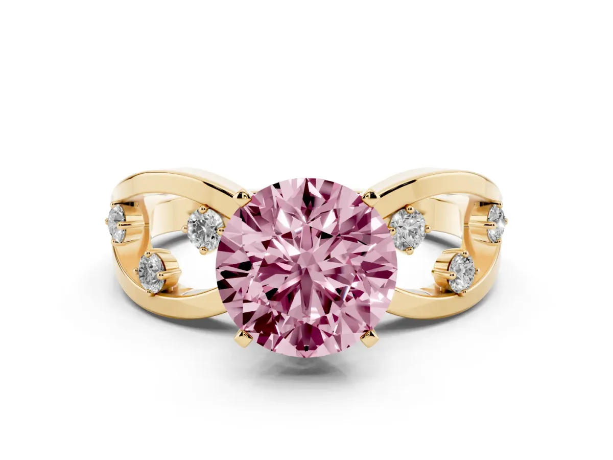 Fancy Pink Round Cut Cut Solitaire Diamond with Side Stones on Criss-Cross Band and Four-Prong Setting Yellow gold