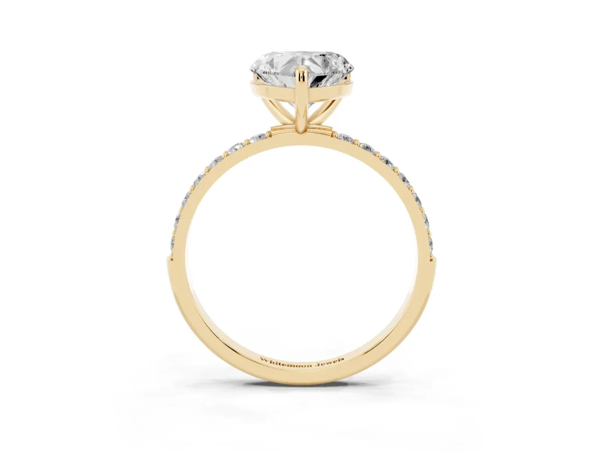 Heart Cut Diamond Solitaire Ring with Round Pavé Band and Prong Setting Yellow gold