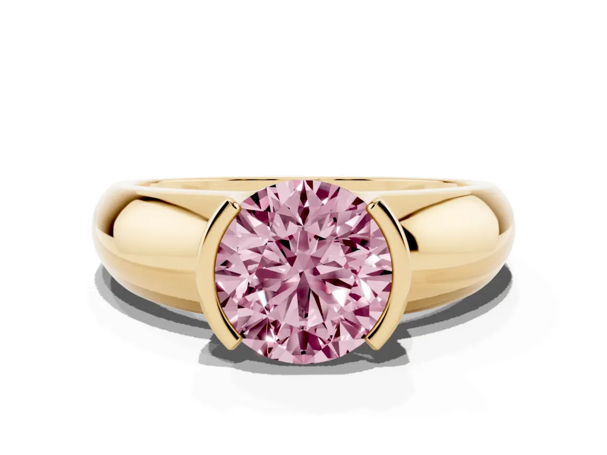 Fancy Pink Round Cut Solitaire Tension Set Diamond Ring with Wide Band Yellow gold