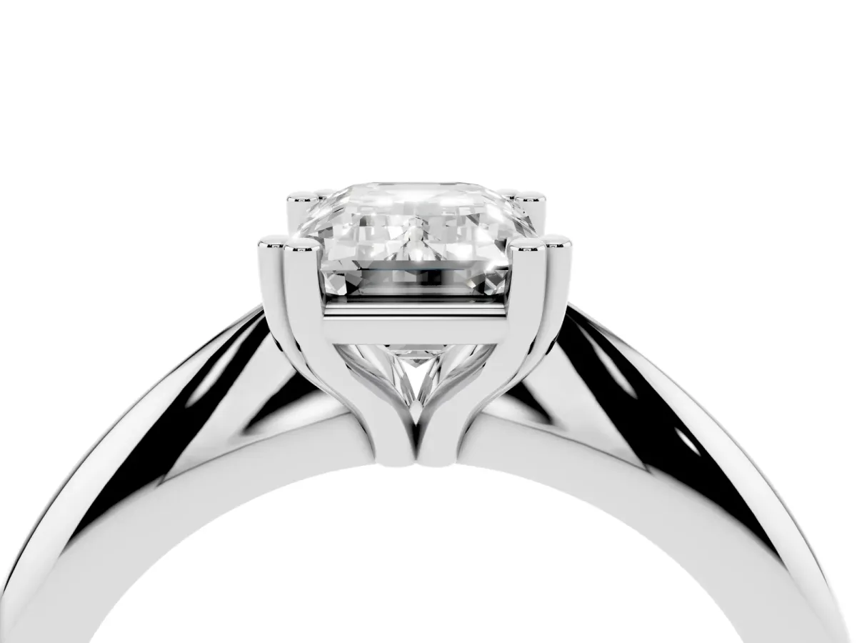 Emerald Cut Cut Solitaire Engagement Ring with Tapered Band and Four-Prong Setting Silver