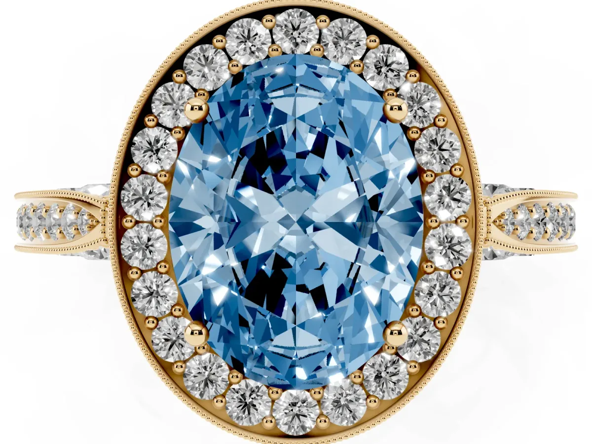 Fancy Blue Oval Cut Halo Diamond Engagement Ring with Split Shank Band and Four-Prong Setting Yellow gold