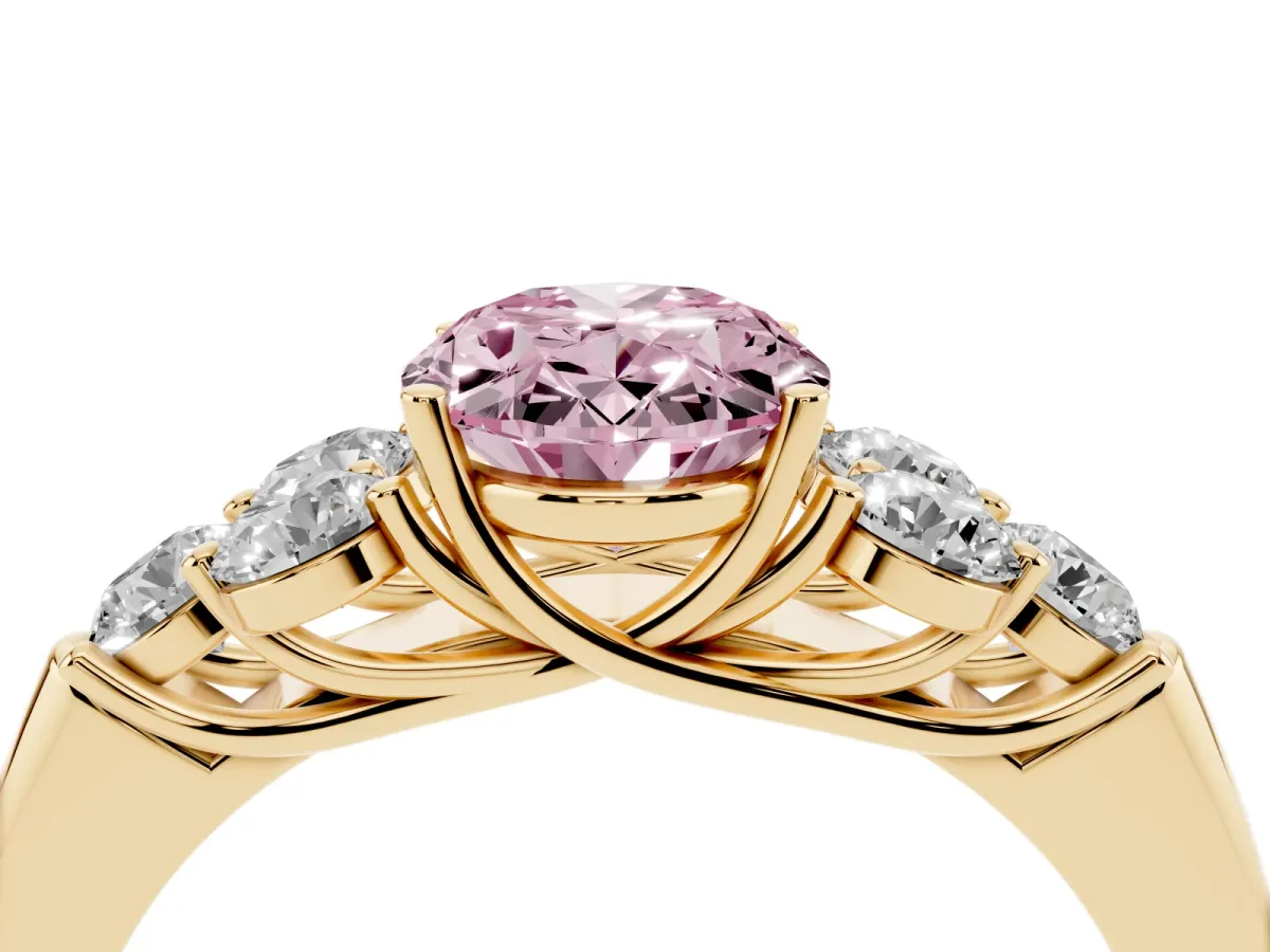 Fancy Pink Oval Cut Cut Diamond Cluster Ring with Round Accent Stones and Prong Setting on a Classic Band Yellow gold