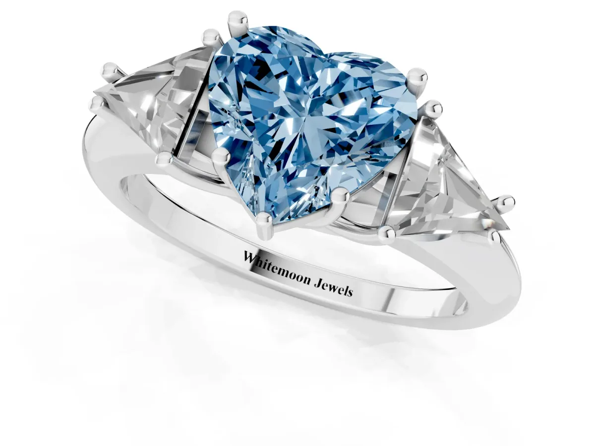 Fancy Blue Three-Stone Heart Cut Diamond Engagement Ring with Trillion Side Stones and Prong Setting Silver