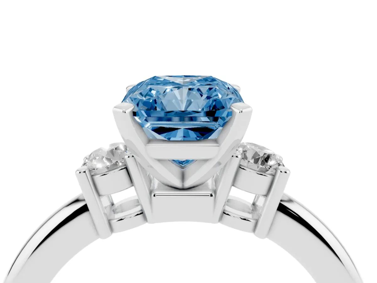 Fancy Blue Three-Stone Radiant Cut Cut Diamond Solitaire with Prong Setting and Classic Band Platinum