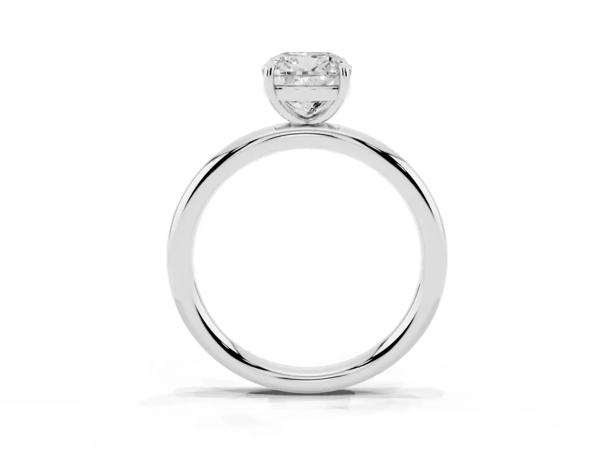 Cushion Cut Solitaire Diamond Ring with Four-Prong Setting on a Plain Band Platinum