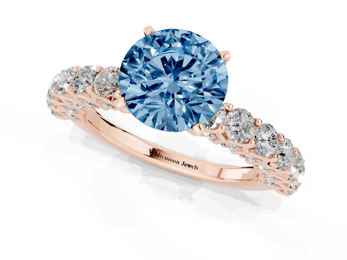 Fancy Blue Round Cut Diamond Solitaire Ring with Shared Prong Pavé Band and Four-Prong Setting Rose gold