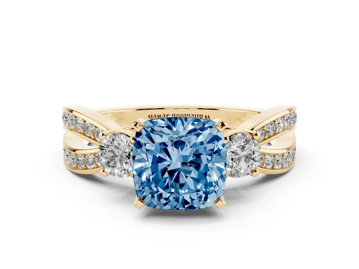 Fancy Blue Three-Stone Cushion Cut Cut Diamond Twist Band with Prong Setting Yellow gold