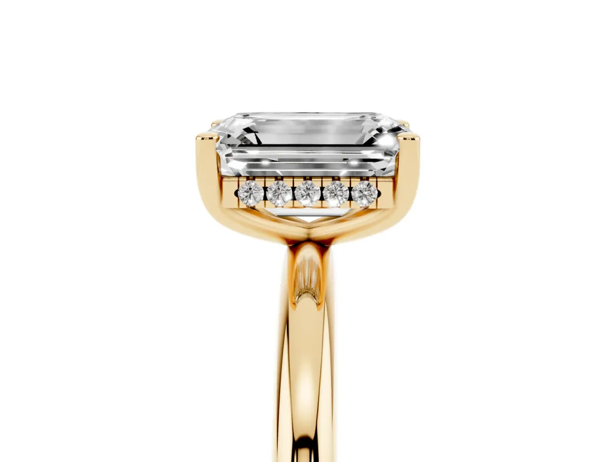 Emerald Cut Cut Solitaire Engagement Ring with Four-Prong Setting and Classic Band Yellow gold