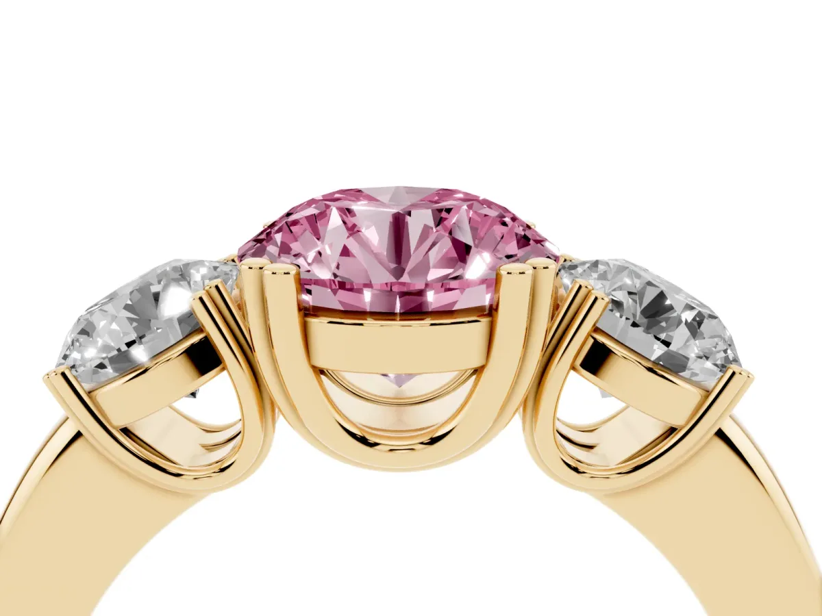 Fancy Pink Three-Stone Round Cut Cut Diamond Ring with Channel Set Band and Four-Prong Setting Yellow gold