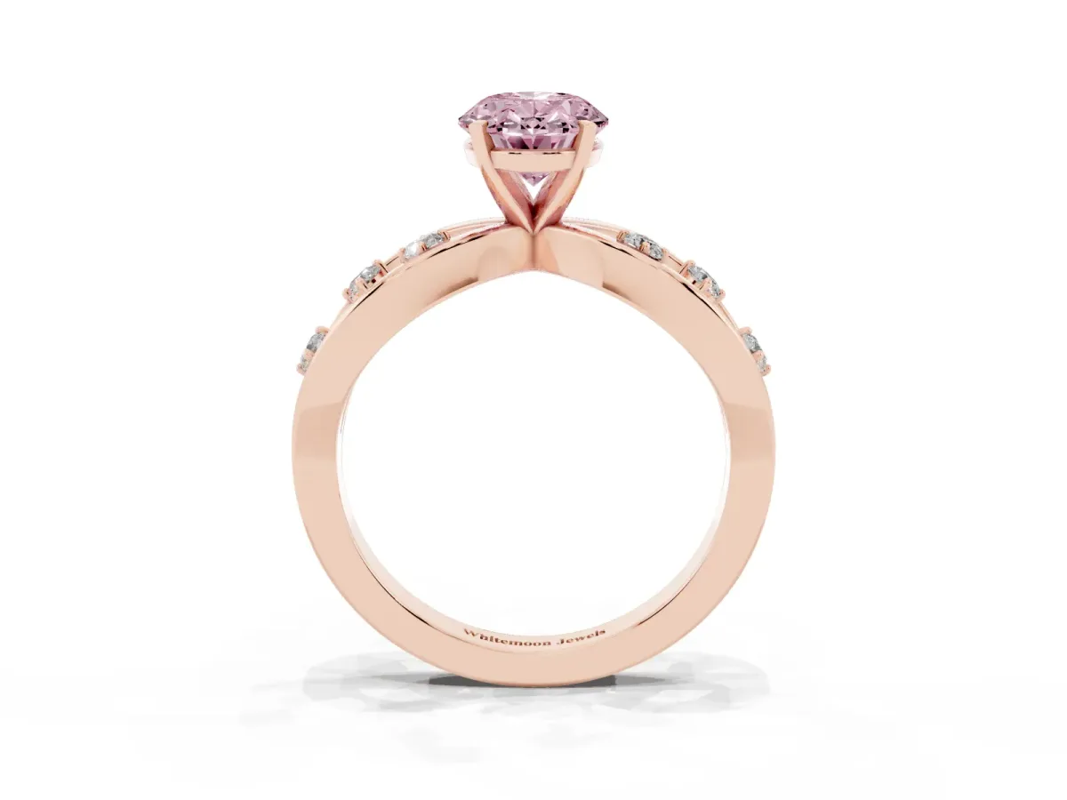 Fancy Pink Oval Cut Cut Solitaire Diamond with Side Stones on Criss-Cross Band and Four-Prong Setting Rose gold