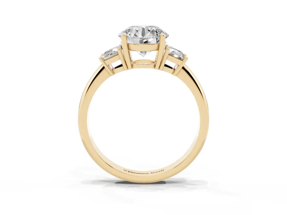 Round Cut Diamond Three-Stone Ring with Trapezoid Side Stones and Prong Setting Yellow gold